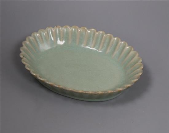 A Chinese celadon glazed dish length 18.5cm